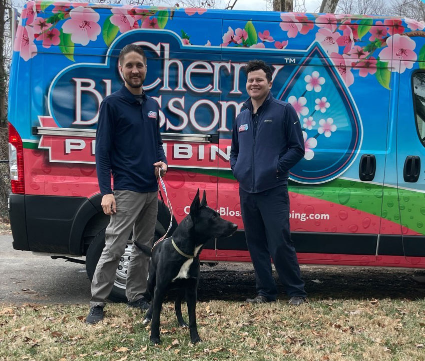 technicians with puppy